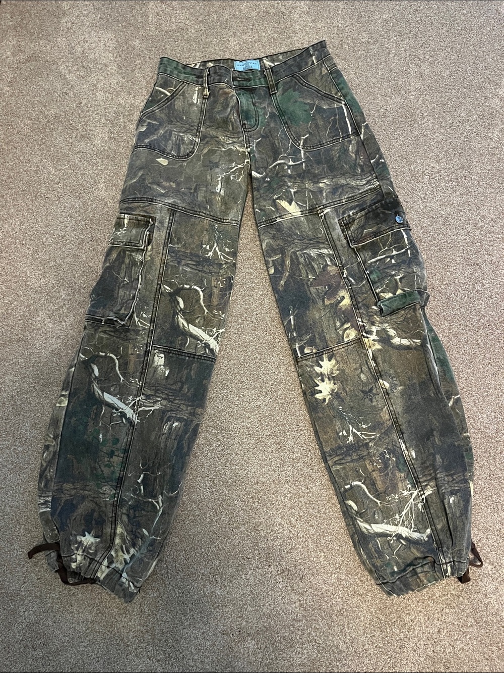 REVICE Woman’s Amelia Oakland Relaxed Cargo Pants in Real Tree Camo Colorway